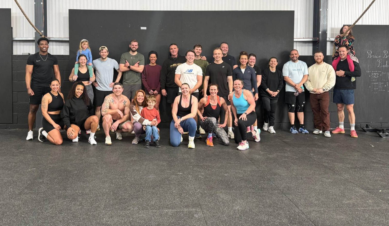 CrossFit Reigate members, coaches and their families together in the gym